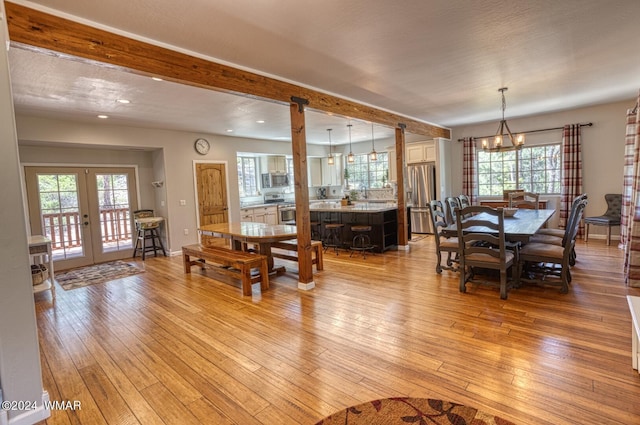 2020 S Pleasantview Dr, Show Low, AZ 85901 - dining area with light wood-style flooring, french doors, plenty of natural light, beam ceiling, and recessed lighting