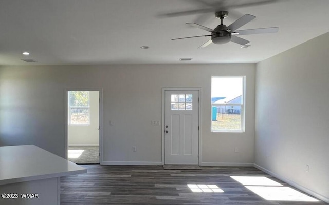 foyer featuring dark wood-style floors, recessed lighting, visible vents, and baseboards