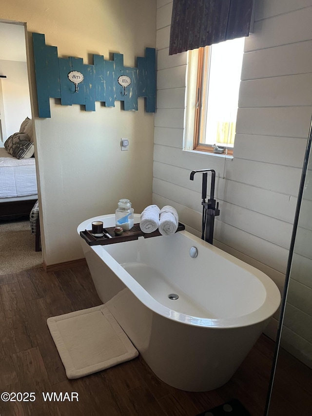 1420 W Haystack Rd, Taylor, AZ 85939 - full bathroom featuring a soaking tub, wood finished floors, and wooden walls