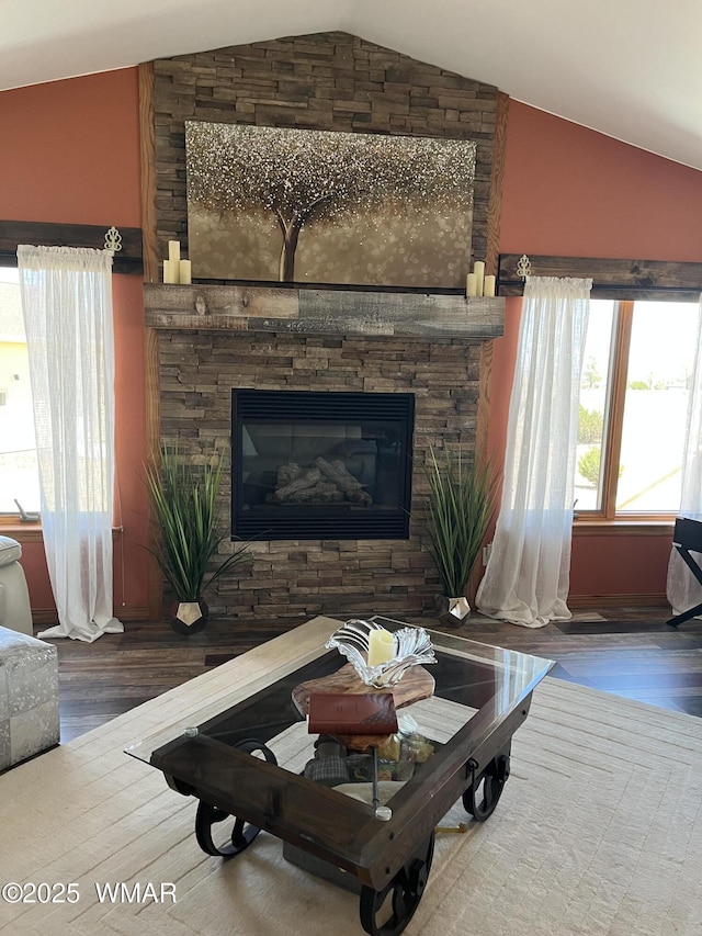 1420 W Haystack Rd, Taylor, AZ 85939 - living area featuring vaulted ceiling, wood finished floors, and a fireplace