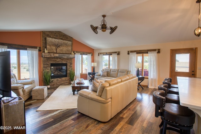 1420 W Haystack Rd, Taylor, AZ 85939 - living area featuring lofted ceiling, dark wood finished floors, and a stone fireplace