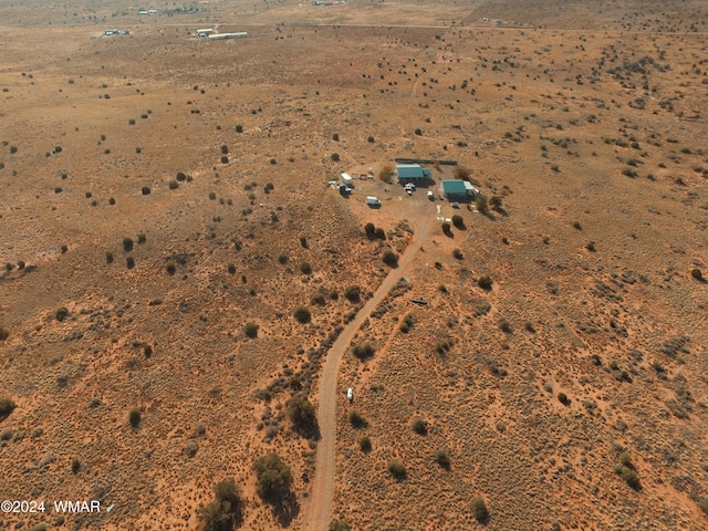 birds eye view of property with view of desert