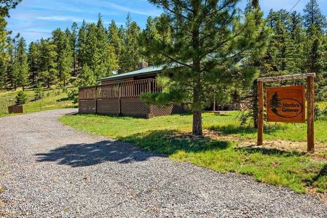 exterior space with gravel driveway