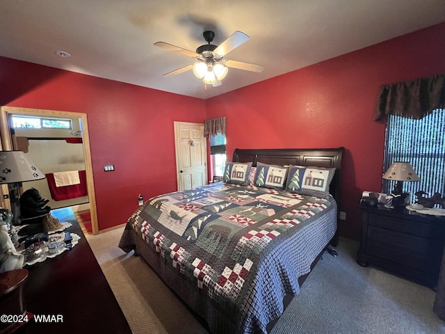 bedroom featuring a ceiling fan and light colored carpet