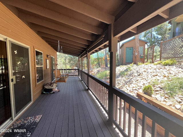 wooden deck with an outdoor structure