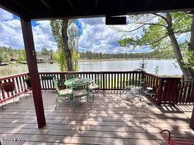 wooden deck featuring a water view