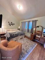 bedroom with wood finished floors