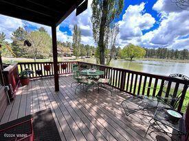 deck featuring a water view