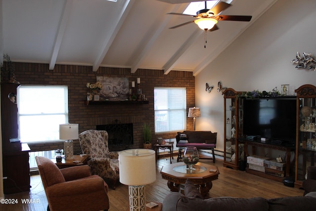 living room with lofted ceiling with beams, brick wall, a fireplace, a ceiling fan, and wood finished floors