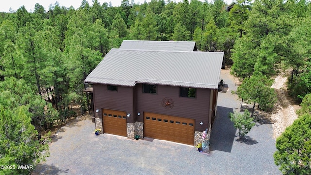 bird's eye view featuring a forest view