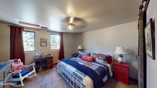 bedroom with ceiling fan, dark colored carpet, and visible vents