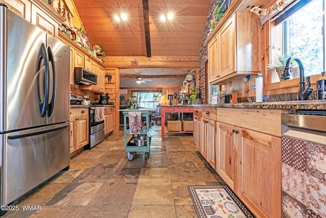 3738 Apache Trl, Pine, AZ 85544 - kitchen featuring appliances with stainless steel finishes, wooden ceiling, dark countertops, stone finish flooring, and light brown cabinets