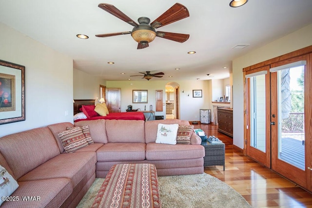 1961 S Canyon Ridge Trl, Show Low, AZ 85901 - living area featuring light wood finished floors, recessed lighting, arched walkways, and a ceiling fan
