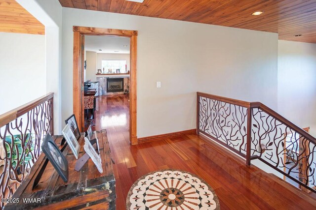 1961 S Canyon Ridge Trl, Show Low, AZ 85901 - hall with wood finished floors, baseboards, wooden ceiling, an upstairs landing, and recessed lighting