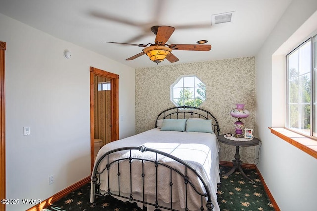 1961 S Canyon Ridge Trl, Show Low, AZ 85901 - bedroom featuring multiple windows, baseboards, and carpet floors