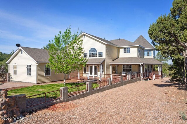 1961 S Canyon Ridge Trl, Show Low, AZ 85901 - view of front of home featuring covered porch, fence, and roof with shingles