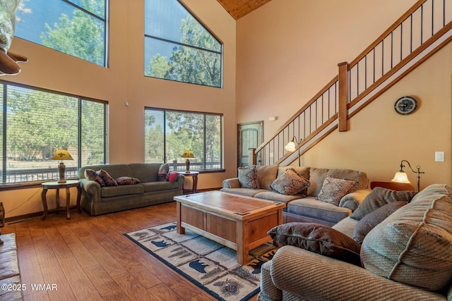 5621 E Starlight Ridge Rd, Lakeside, AZ 85929 - living room with high vaulted ceiling, hardwood / wood-style floors, and stairs