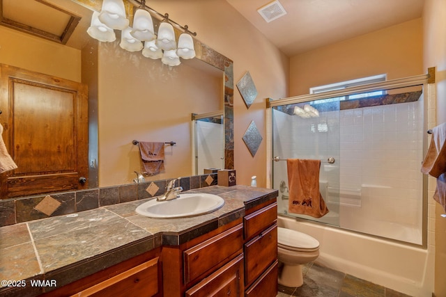 5621 E Starlight Ridge Rd, Lakeside, AZ 85929 - full bath featuring vanity, shower / bath combination with glass door, and stone finish floors