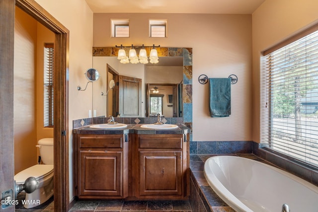 5621 E Starlight Ridge Rd, Lakeside, AZ 85929 - full bathroom featuring a garden tub, double vanity, and plenty of natural light