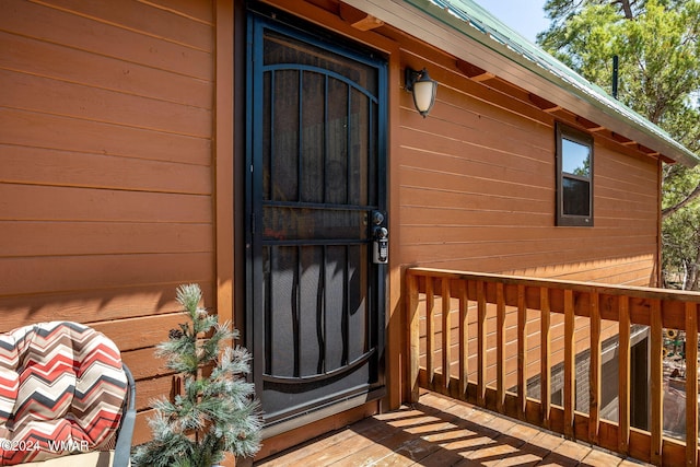 doorway to property with a deck