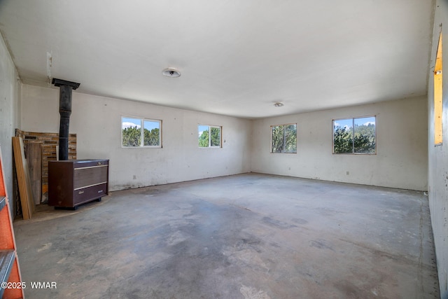 1720 E Becker Lane Loop, Springerville, AZ 85938 - spare room featuring concrete floors and a wood stove
