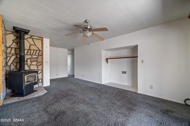 1720 E Becker Lane Loop, Springerville, AZ 85938 - unfurnished living room with carpet floors, a ceiling fan, and a wood stove