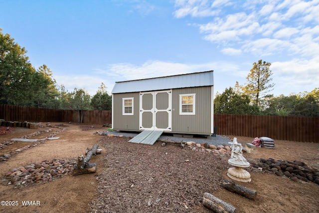 view of shed featuring a fenced backyard