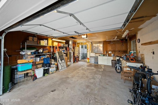 garage featuring a workshop area and a garage door opener