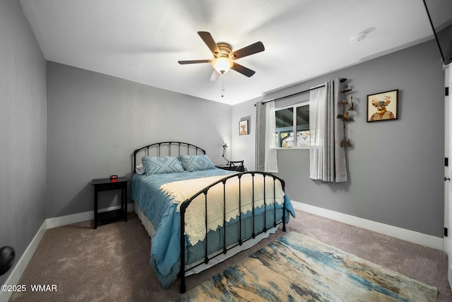 carpeted bedroom with a ceiling fan and baseboards