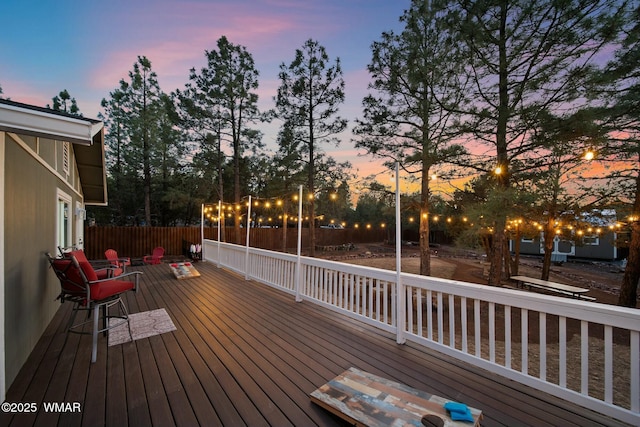 deck at dusk with fence