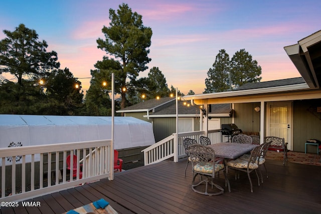 wooden deck with outdoor dining area