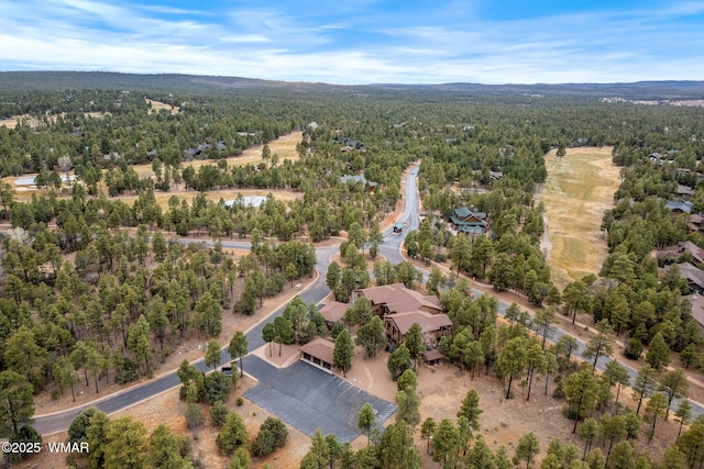 bird's eye view featuring a wooded view