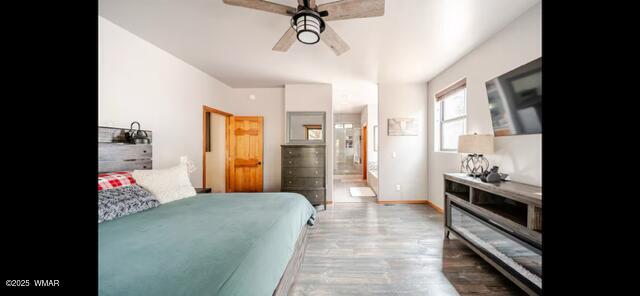 2930 W Lodgepole Ln, Show Low, AZ 85901 - bedroom featuring wood finished floors, baseboards, ensuite bath, and a ceiling fan