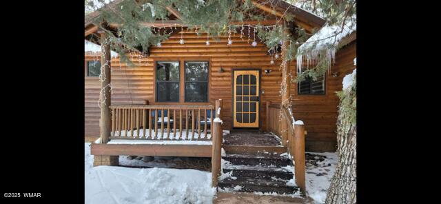 2930 W Lodgepole Ln, Show Low, AZ 85901 - view of snow covered property entrance
