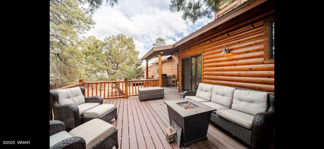 2930 W Lodgepole Ln, Show Low, AZ 85901 - wooden deck with an outdoor living space with a fire pit