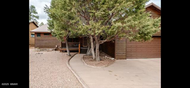 2930 W Lodgepole Ln, Show Low, AZ 85901 - view of patio featuring a garage and driveway