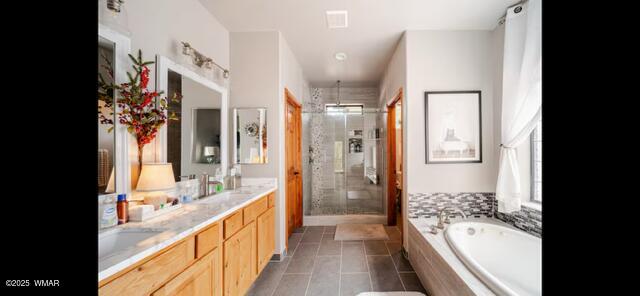 2930 W Lodgepole Ln, Show Low, AZ 85901 - bathroom with a stall shower, a bath, double vanity, and tile patterned floors