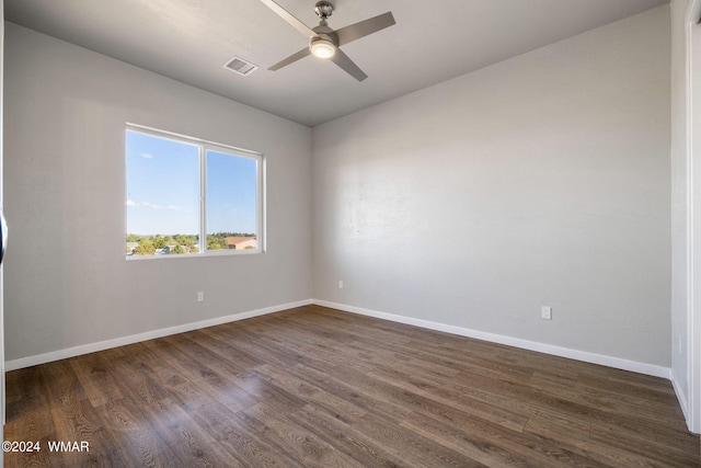 159 Willis St, Taylor, AZ 85939 - unfurnished room featuring baseboards, visible vents, dark wood finished floors, and a ceiling fan