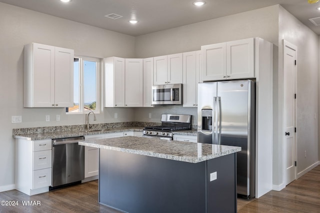 159 Willis St, Taylor, AZ 85939 - kitchen with a sink, appliances with stainless steel finishes, a kitchen island, and white cabinetry