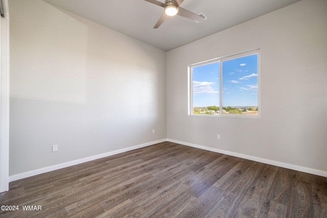 159 Willis St, Taylor, AZ 85939 - unfurnished room featuring ceiling fan, baseboards, and dark wood finished floors