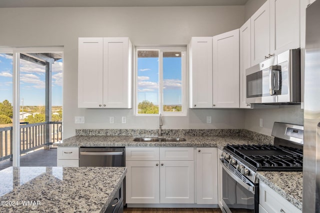 159 Willis St, Taylor, AZ 85939 - kitchen with stainless steel appliances, a sink, and white cabinetry