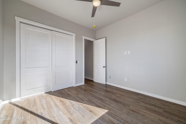 159 Willis St, Taylor, AZ 85939 - unfurnished bedroom featuring dark wood-style flooring, a closet, a ceiling fan, and baseboards