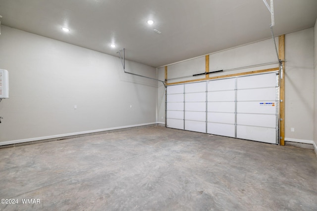 159 Willis St, Taylor, AZ 85939 - garage featuring baseboards and recessed lighting