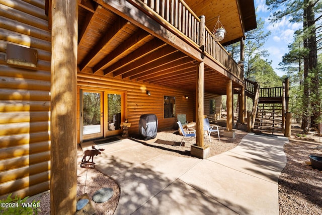 view of patio with french doors and stairway