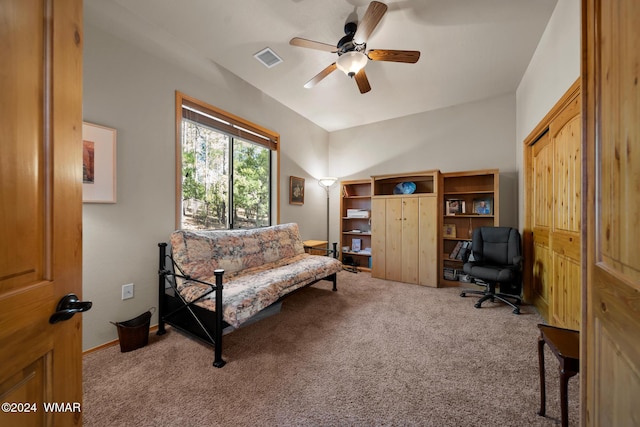 sitting room with carpet floors, baseboards, visible vents, and a ceiling fan