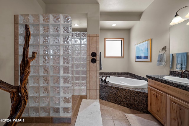 full bath featuring vanity, a walk in shower, a bath, and tile patterned floors