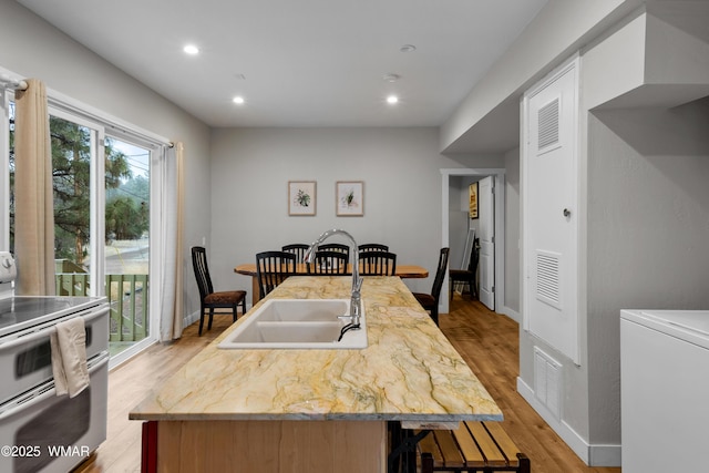dining space with recessed lighting, baseboards, visible vents, and light wood-style floors