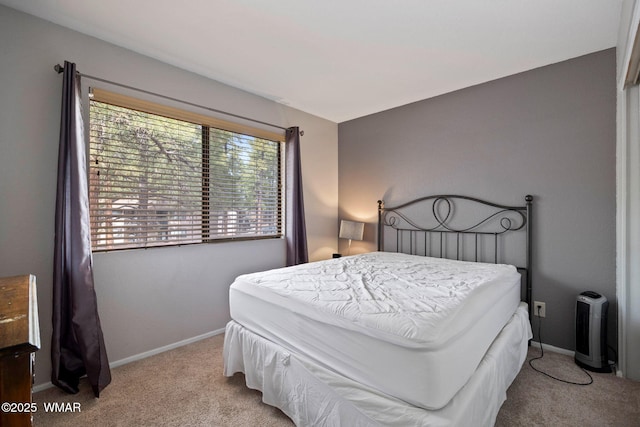 carpeted bedroom with baseboards