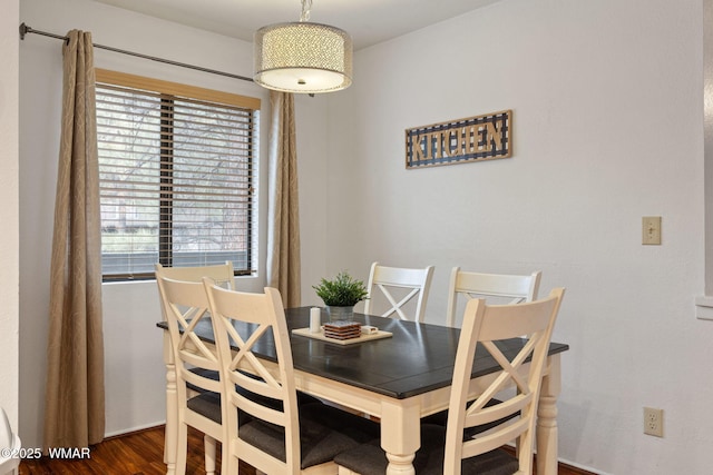 dining area with wood finished floors