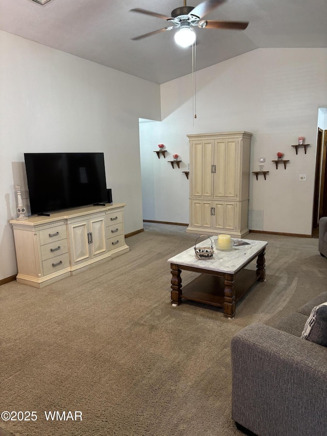 living room featuring light carpet, baseboards, ceiling fan, and vaulted ceiling